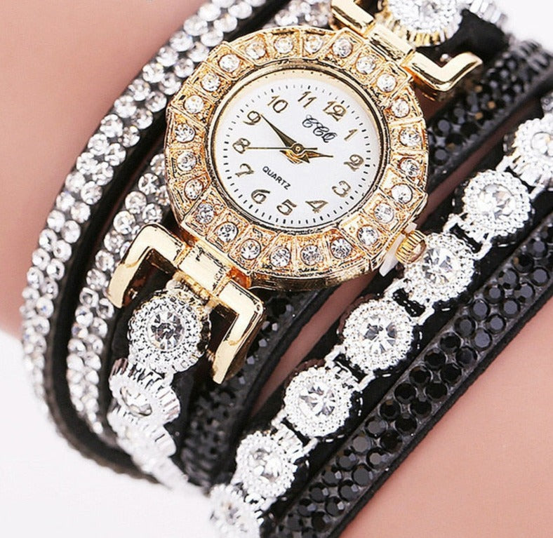 Fashionably stylish and casually chic, this watch features shock-resistant functionality and a secure hook buckle. Its round case is made of durable plastic, while the band is crafted from long-lasting acrylic.