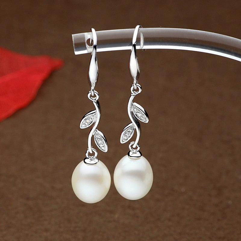 Exuding timeless beauty, these 925 Sterling Silver Freshwater Pearl Long Earrings boast a Bohemia style and a Water Drop pattern that'll captivate your senses. Perfect for women who appreciate the finer things in life, these stunning earrings offer a fine and fashionable look.