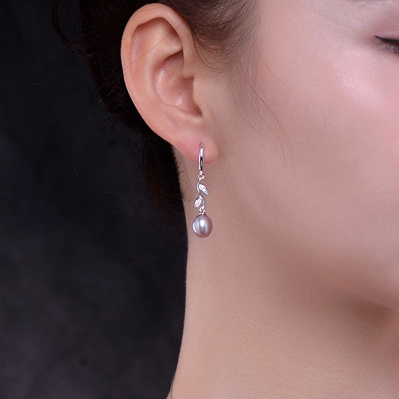 Exuding timeless beauty, these 925 Sterling Silver Freshwater Pearl Long Earrings boast a Bohemia style and a Water Drop pattern that'll captivate your senses. Perfect for women who appreciate the finer things in life, these stunning earrings offer a fine and fashionable look.