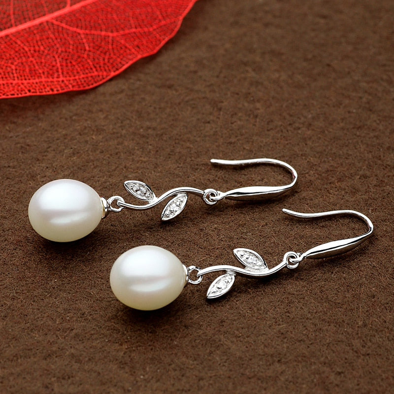 Exuding timeless beauty, these 925 Sterling Silver Freshwater Pearl Long Earrings boast a Bohemia style and a Water Drop pattern that'll captivate your senses. Perfect for women who appreciate the finer things in life, these stunning earrings offer a fine and fashionable look.