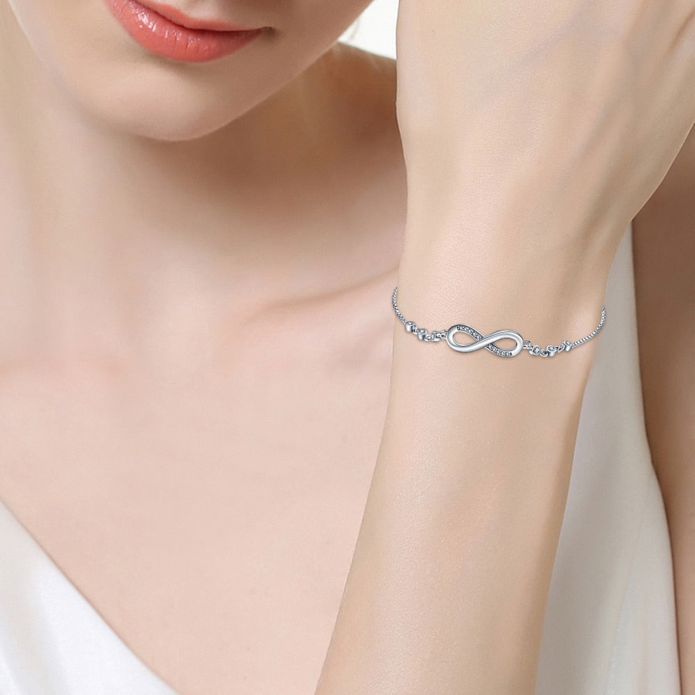 Designed with timeless classic style, this 925 Sterling Silver Infinity Bracelet adds a luxurious look to every ensemble. Perfect for women who cherish fine jewelry, this bracelet is sure to take any outfit to the next level.