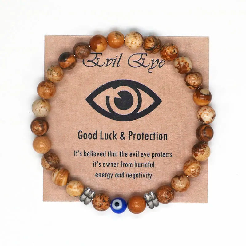The captivating Tiger Eye Beaded Bracelet, a unisex Turkish Amulet that offers protection against the evil eye. This exquisite piece of spiritual jewelry is designed for both men and women, featuring natural Tiger Eye beads and a striking blue Evil Eye charm.