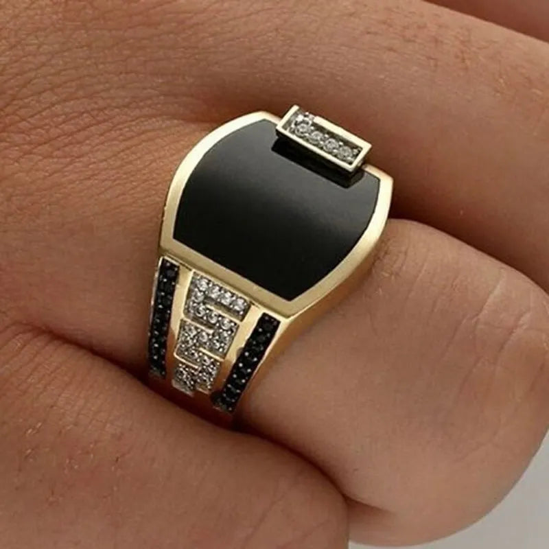 The epitome of elegance with this exquisite men's ring. Crafted from high-quality metal, it features a captivating gold color and is adorned with a striking black stone and zircon accents. Perfect for engagements, weddings, or simply adding a touch of luxury to your everyday style, this punk-inspired ring is a must-have in any fashion-forward man's collection.