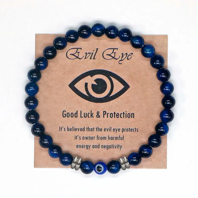 The captivating Tiger Eye Beaded Bracelet, a unisex Turkish Amulet that offers protection against the evil eye. This exquisite piece of spiritual jewelry is designed for both men and women, featuring natural Tiger Eye beads and a striking blue Evil Eye charm.
