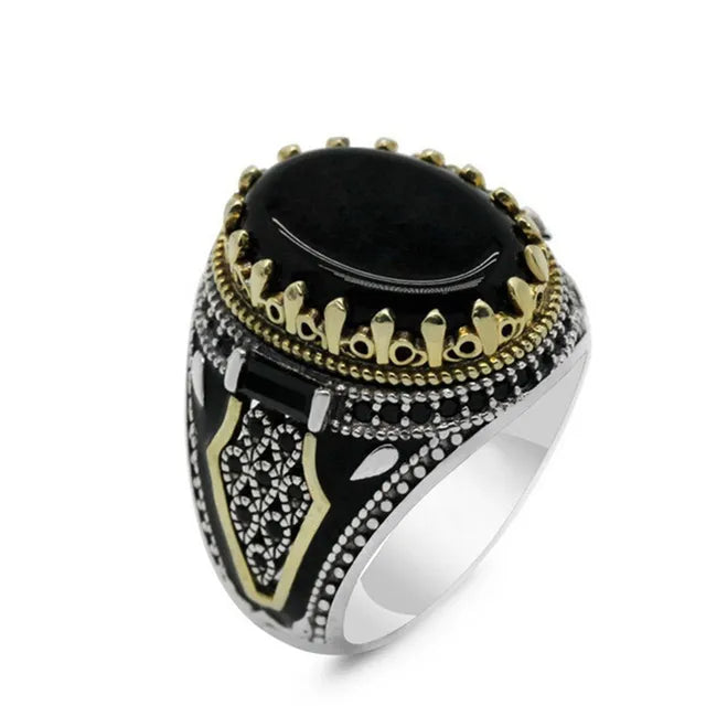 The epitome of elegance with this exquisite men's ring. Crafted from high-quality metal, it features a captivating gold color and is adorned with a striking black stone and zircon accents. Perfect for engagements, weddings, or simply adding a touch of luxury to your everyday style, this punk-inspired ring is a must-have in any fashion-forward man's collection.