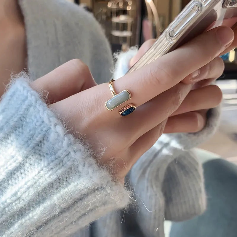 The latest French-inspired jewelry trend of 2021 with this elegant New Retro Square Blue Oil Dripping Ring. Designed to exude a fashionable temperament, this simple opening ring is a must-have for women who appreciate timeless style and sophistication. Elevate your jewelry collection with this stunning piece.