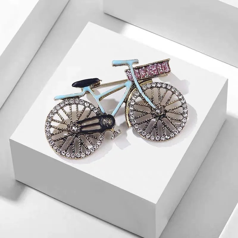 This enamel brooch is a unique and stylish accessory for cyclists. With its vintage bicycle shape and creative colors, it adds a touch of creativity to any outfit. The rhinestone and metal details enhance its elegance, making it a perfect gift for jewelry lovers.