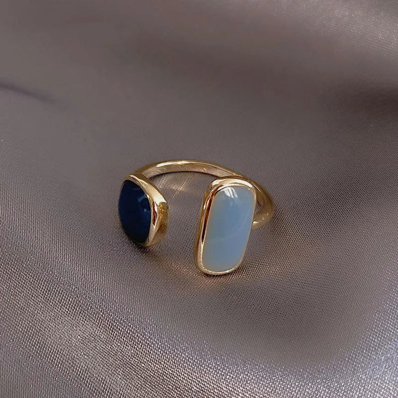 The latest French-inspired jewelry trend of 2021 with this elegant New Retro Square Blue Oil Dripping Ring. Designed to exude a fashionable temperament, this simple opening ring is a must-have for women who appreciate timeless style and sophistication. Elevate your jewelry collection with this stunning piece.