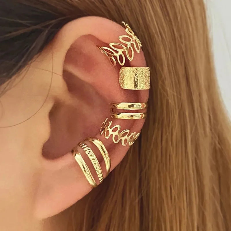 This set includes five pieces of vintage-style gold color leaf ear cuffs that do not require piercing, designed as fake cartilage clip earrings suitable for both women and men who appreciate creative and trendy jewelry pieces.
