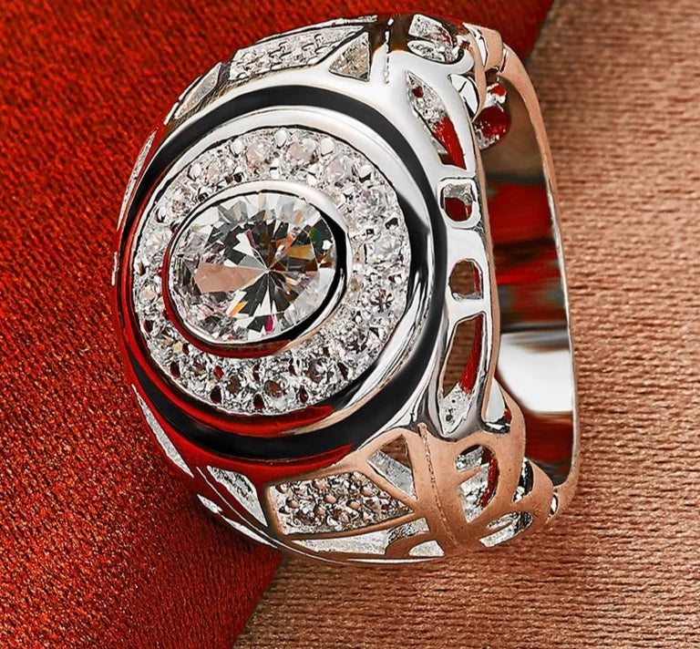 Our exquisite collection of 925 Sterling Silver rings, available in sizes 6-10 for both women and men. Adorned with a captivating large zircon stone, these rings are perfect for fashion-forward individuals looking to make a statement. Whether it's for a wedding, engagement, or any special occasion, our fine jewelry pieces are designed to add charm and elegance to your party ensemble.