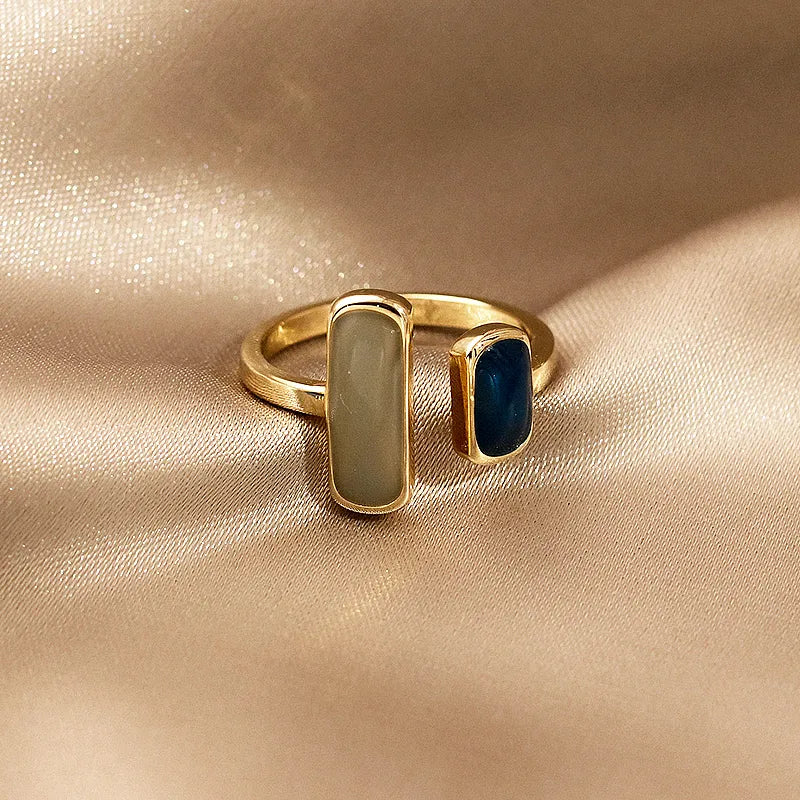 The latest French-inspired jewelry trend of 2021 with this elegant New Retro Square Blue Oil Dripping Ring. Designed to exude a fashionable temperament, this simple opening ring is a must-have for women who appreciate timeless style and sophistication. Elevate your jewelry collection with this stunning piece.