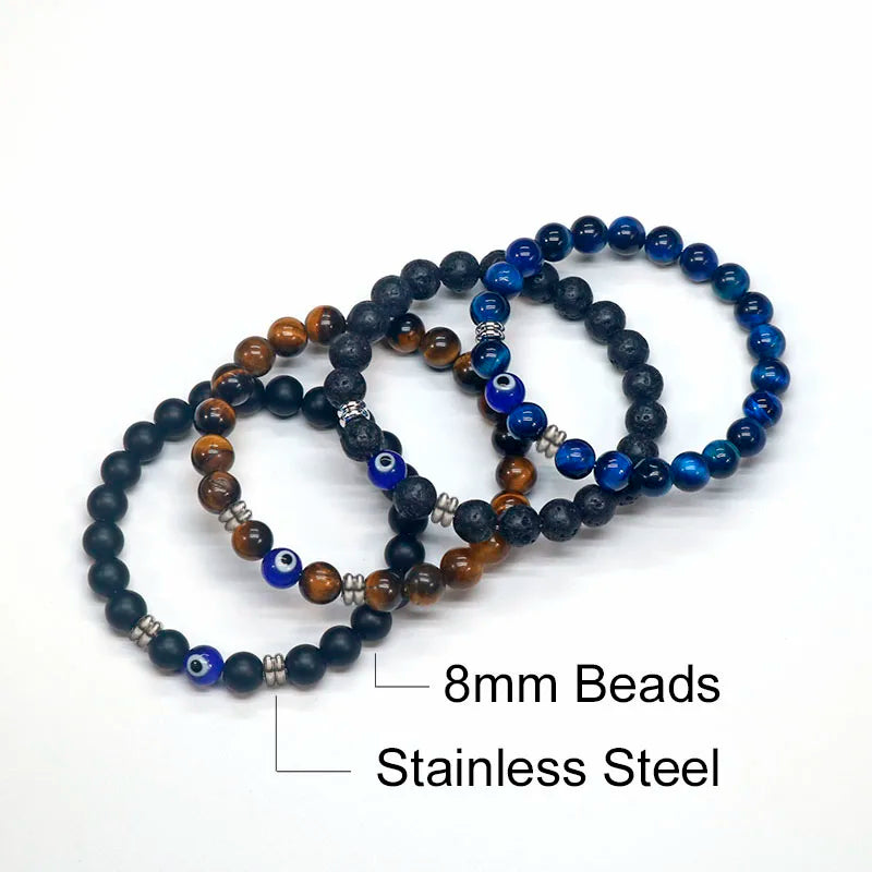 The captivating Tiger Eye Beaded Bracelet, a unisex Turkish Amulet that offers protection against the evil eye. This exquisite piece of spiritual jewelry is designed for both men and women, featuring natural Tiger Eye beads and a striking blue Evil Eye charm.