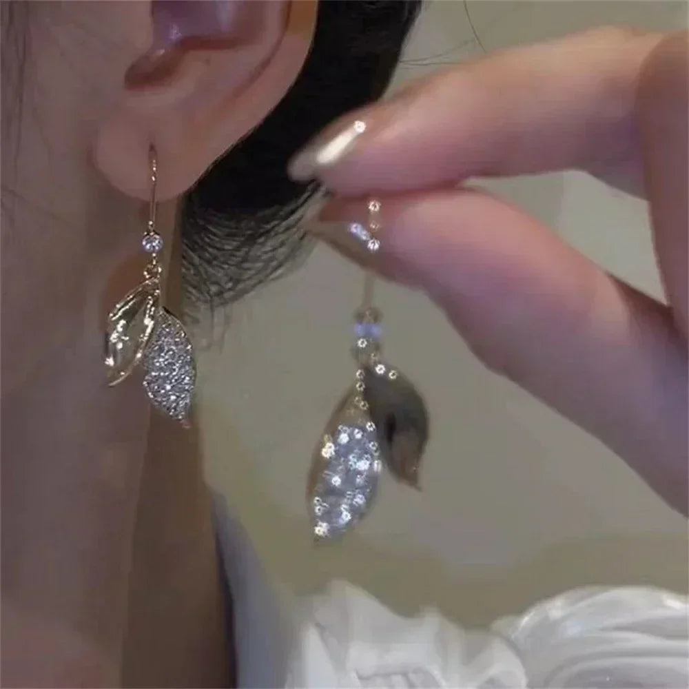 The latest fashion trend of these stunning Zircon Leaf Earrings, featuring a unique and elegant design. Perfect for weddings, parties, or as a premium gift for women who appreciate exquisite jewelry.