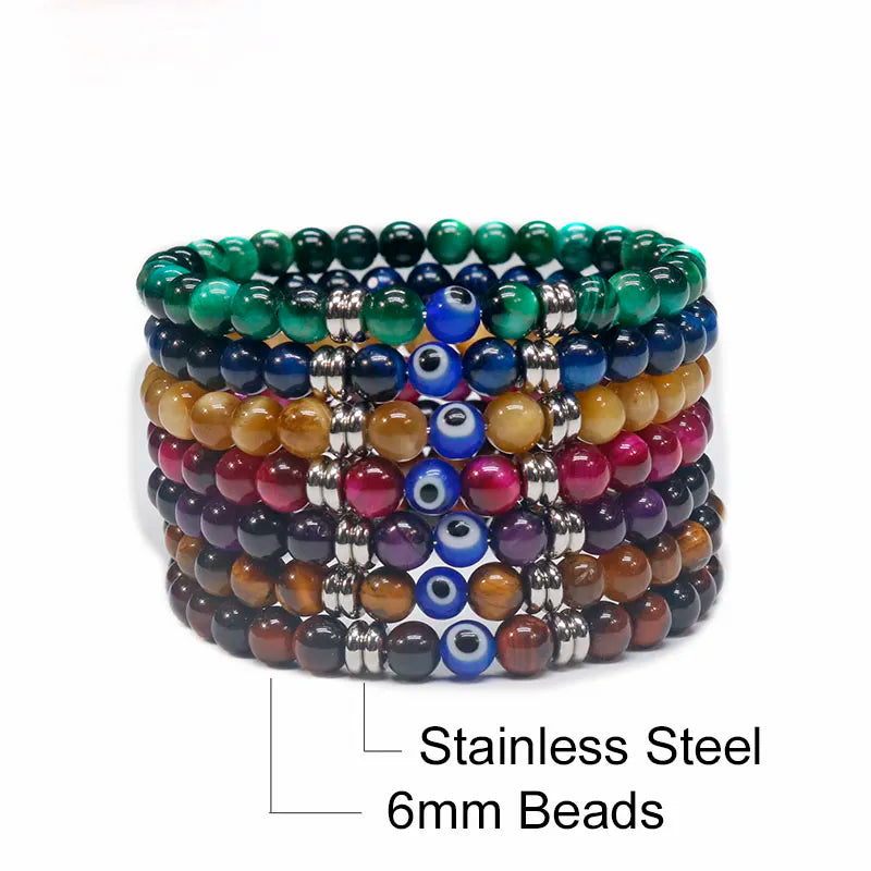 The captivating Tiger Eye Beaded Bracelet, a unisex Turkish Amulet that offers protection against the evil eye. This exquisite piece of spiritual jewelry is designed for both men and women, featuring natural Tiger Eye beads and a striking blue Evil Eye charm.