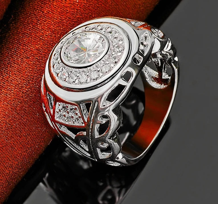 Our exquisite collection of 925 Sterling Silver rings, available in sizes 6-10 for both women and men. Adorned with a captivating large zircon stone, these rings are perfect for fashion-forward individuals looking to make a statement. Whether it's for a wedding, engagement, or any special occasion, our fine jewelry pieces are designed to add charm and elegance to your party ensemble.