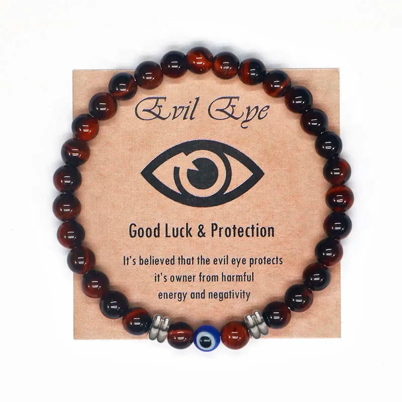 The captivating Tiger Eye Beaded Bracelet, a unisex Turkish Amulet that offers protection against the evil eye. This exquisite piece of spiritual jewelry is designed for both men and women, featuring natural Tiger Eye beads and a striking blue Evil Eye charm.