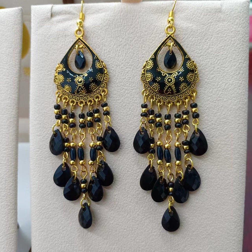 These Bohema Ethnic Fringed Tassel Earrings boast a stylish geometric shape and are crafted with a glossy acrylic water drop. Women of all ages will love wearing these beautiful metal earrings.