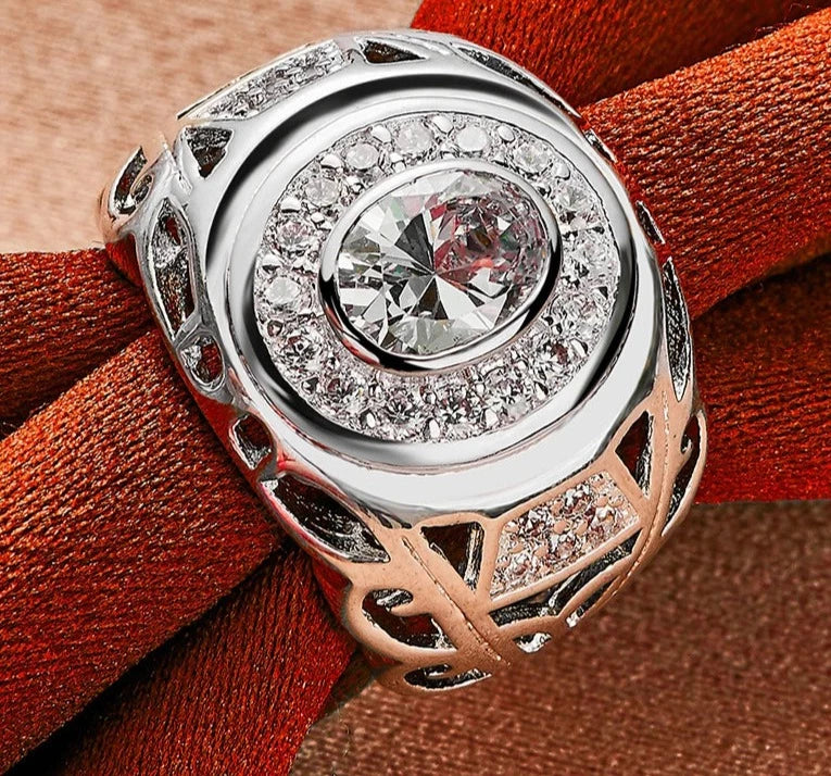 Our exquisite collection of 925 Sterling Silver rings, available in sizes 6-10 for both women and men. Adorned with a captivating large zircon stone, these rings are perfect for fashion-forward individuals looking to make a statement. Whether it's for a wedding, engagement, or any special occasion, our fine jewelry pieces are designed to add charm and elegance to your party ensemble.