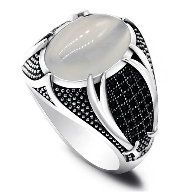 The epitome of elegance with this exquisite men's ring. Crafted from high-quality metal, it features a captivating gold color and is adorned with a striking black stone and zircon accents. Perfect for engagements, weddings, or simply adding a touch of luxury to your everyday style, this punk-inspired ring is a must-have in any fashion-forward man's collection.
