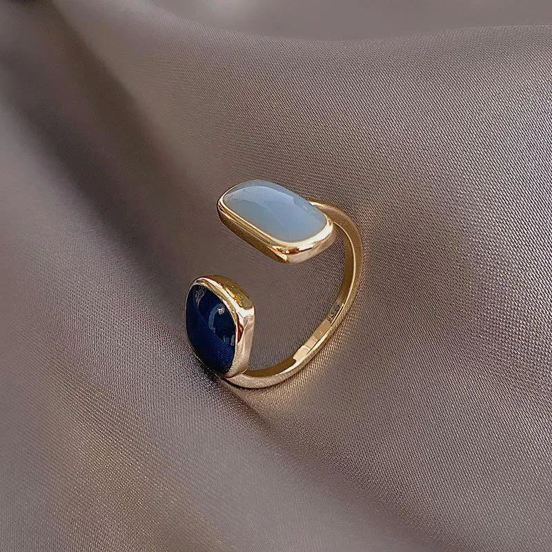 The latest French-inspired jewelry trend of 2021 with this elegant New Retro Square Blue Oil Dripping Ring. Designed to exude a fashionable temperament, this simple opening ring is a must-have for women who appreciate timeless style and sophistication. Elevate your jewelry collection with this stunning piece.