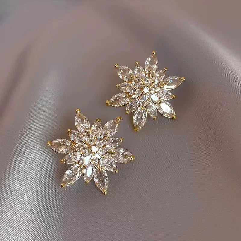 Experience the latest Christmas fashion with our exquisite 2023 collection of earrings. These elegant earrings feature a combination of zircon, pearls, and snowflake designs, adding a touch of sophistication and charm to your look. Perfect for those who appreciate a princess-like style, these earrings are sure to make a statement.