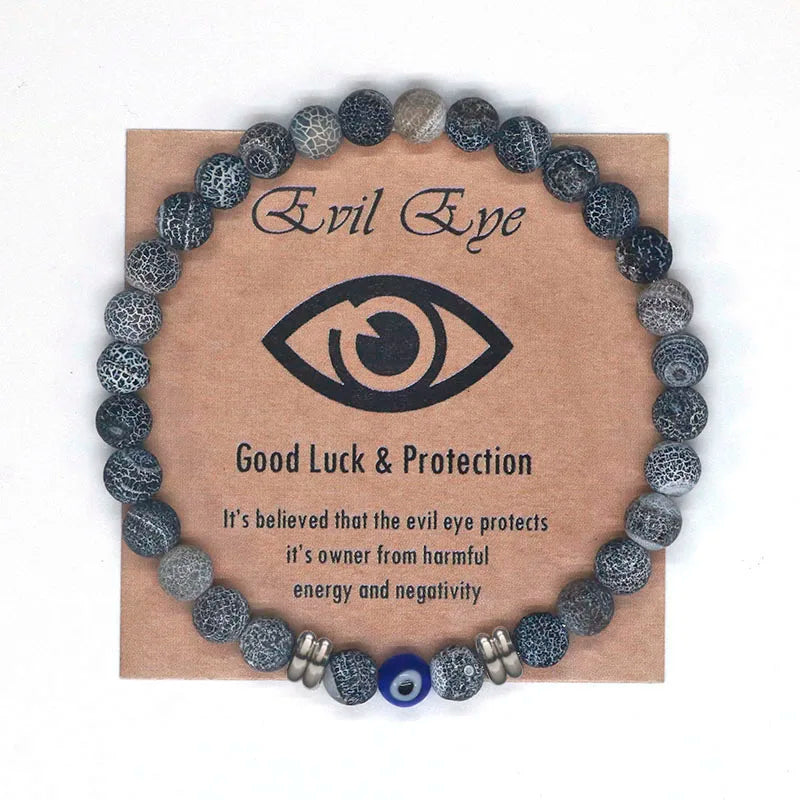 The captivating Tiger Eye Beaded Bracelet, a unisex Turkish Amulet that offers protection against the evil eye. This exquisite piece of spiritual jewelry is designed for both men and women, featuring natural Tiger Eye beads and a striking blue Evil Eye charm.