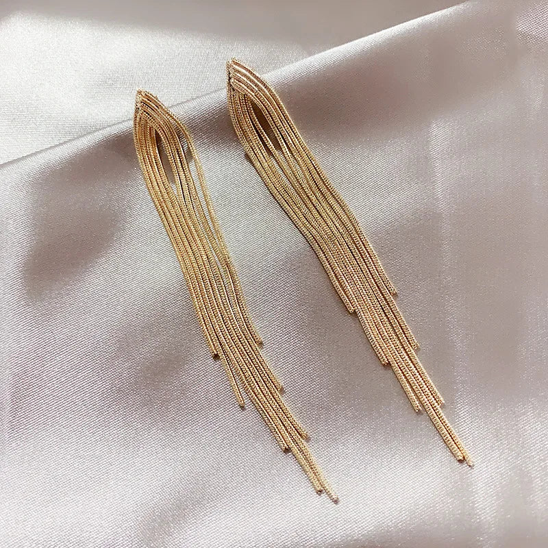 These elegant earrings feature a vintage gold color bar design with long thread tassel drops, perfect for women looking for glossy geometric Korean earrings that are on-trend in new fashion wedding jewelry.